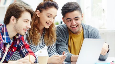 Happy learners video chatting with friends online